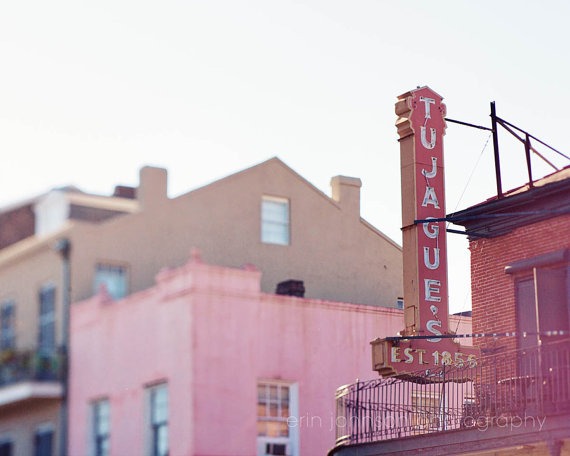 a building with a neon sign on the side of it