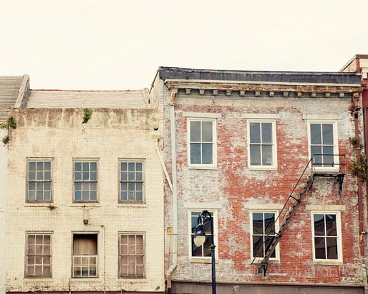 a row of old brick buildings next to each other