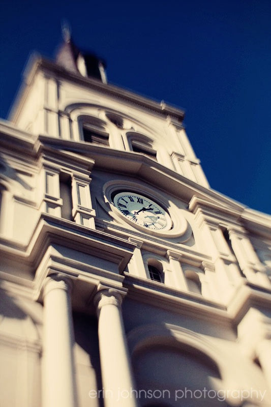 a large clock tower with a sky background