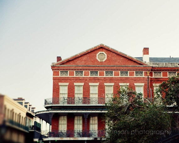 a red brick building with a clock on the top of it