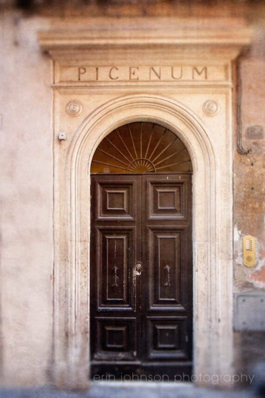 an old building with a large wooden door