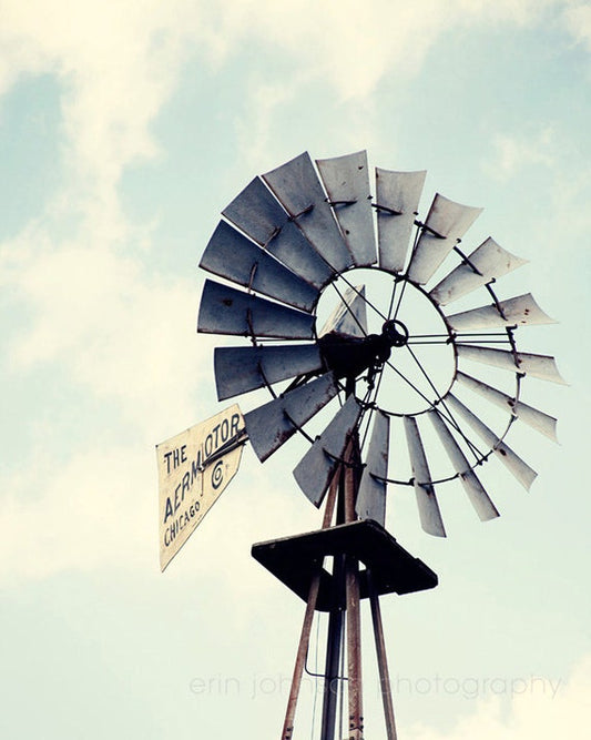 a windmill with a sign on top of it