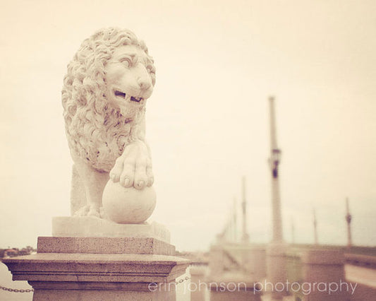 a statue of a lion on top of a building