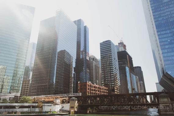 a view of a city with tall buildings and a bridge