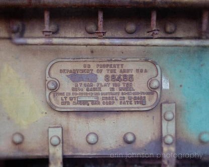 A close-up photograph of a metal train component with a label indicating '38485' and various specifications such as 'L.T.