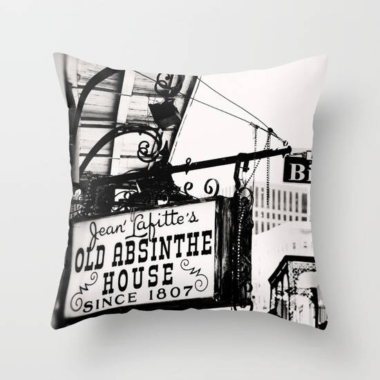 a black and white photo of a sign on a pillow