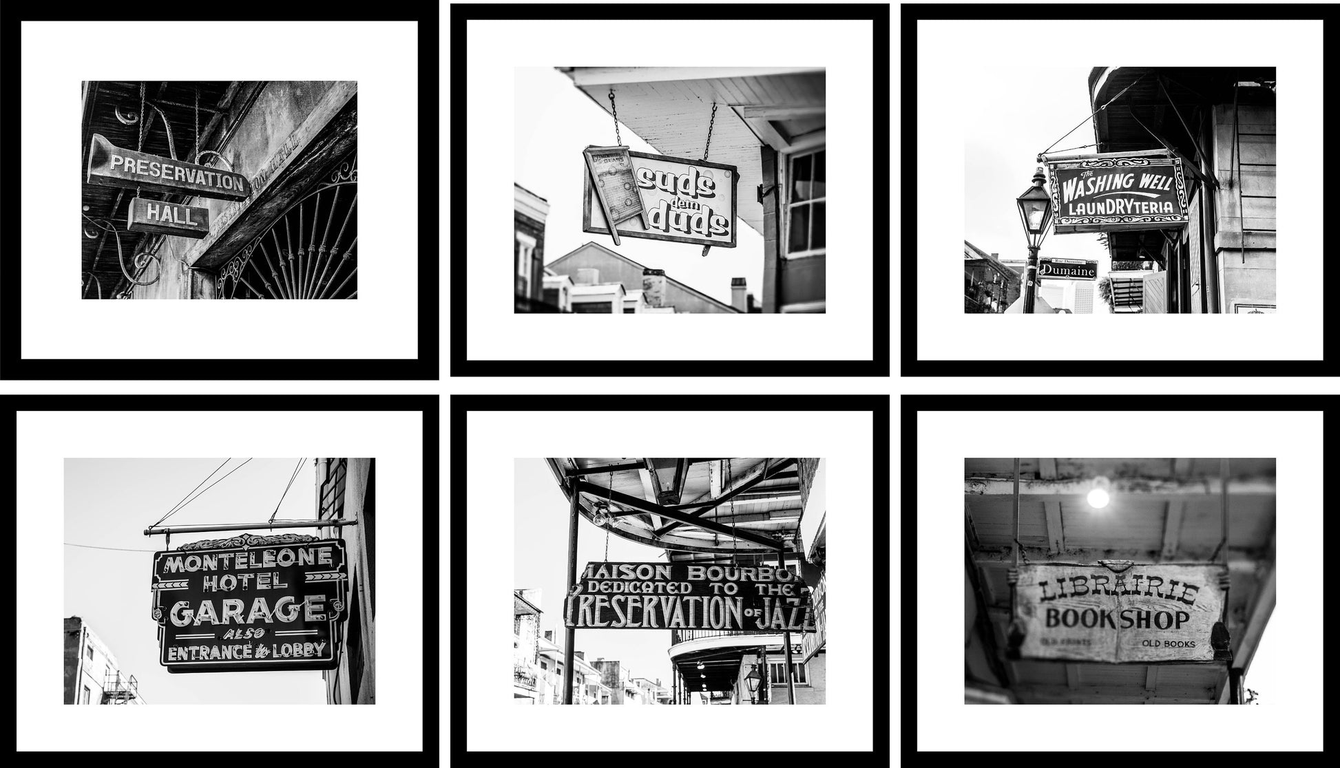 a black and white photo of a bunch of signs