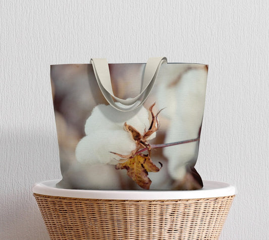 a tote bag with a white flower on it