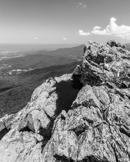 a black and white photo of a rocky outcropping