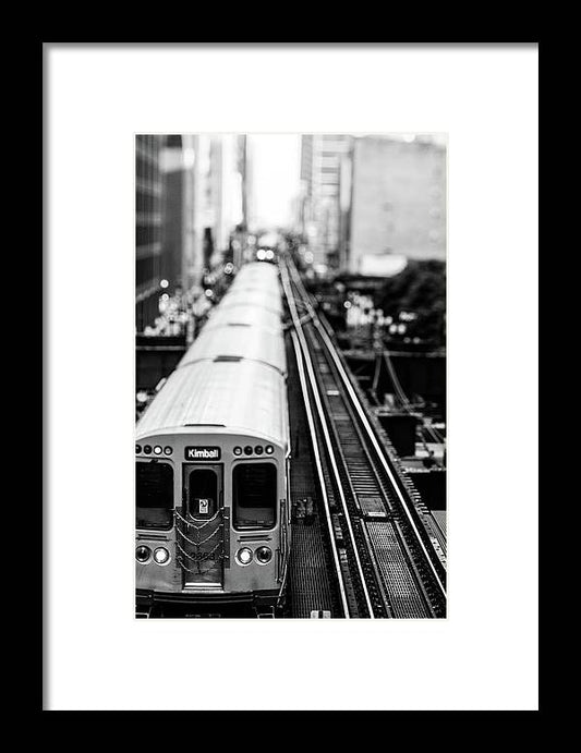 a black and white photo of a train on the tracks