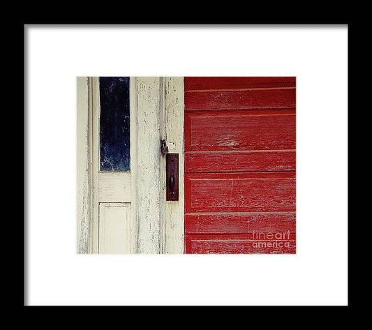a red door and a white door frame