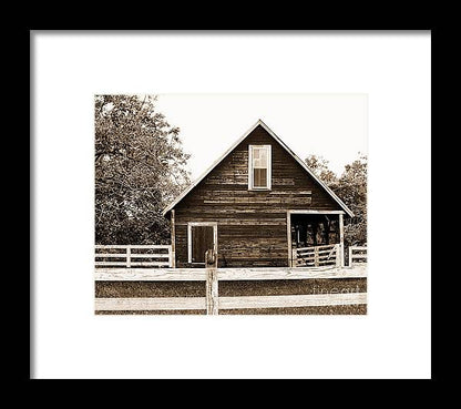 a black and white photo of a barn