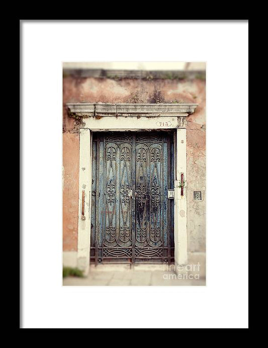 an old door with a wrought iron frame